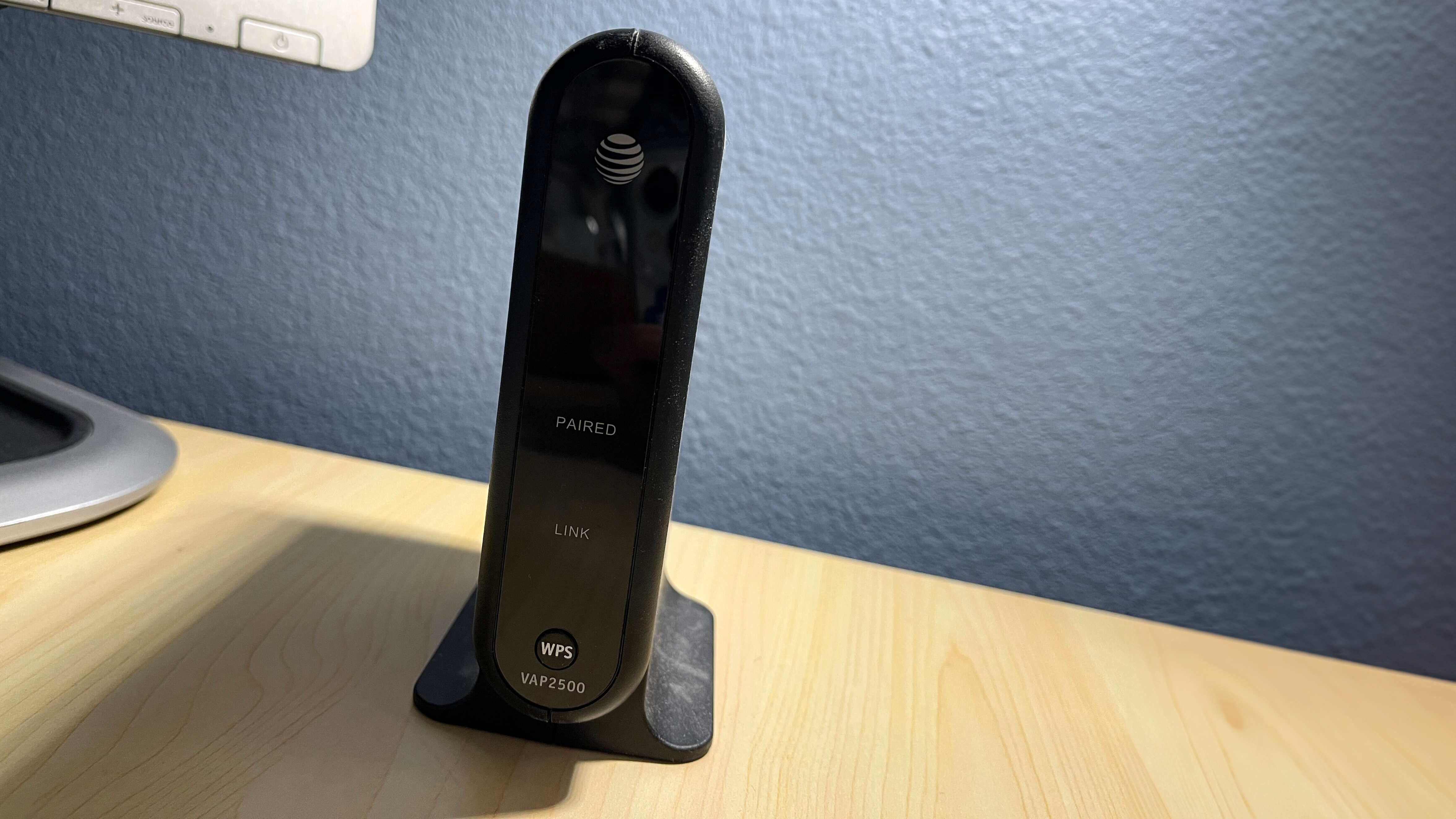 AT&T modem and router sitting on a desktop counter with no lights
