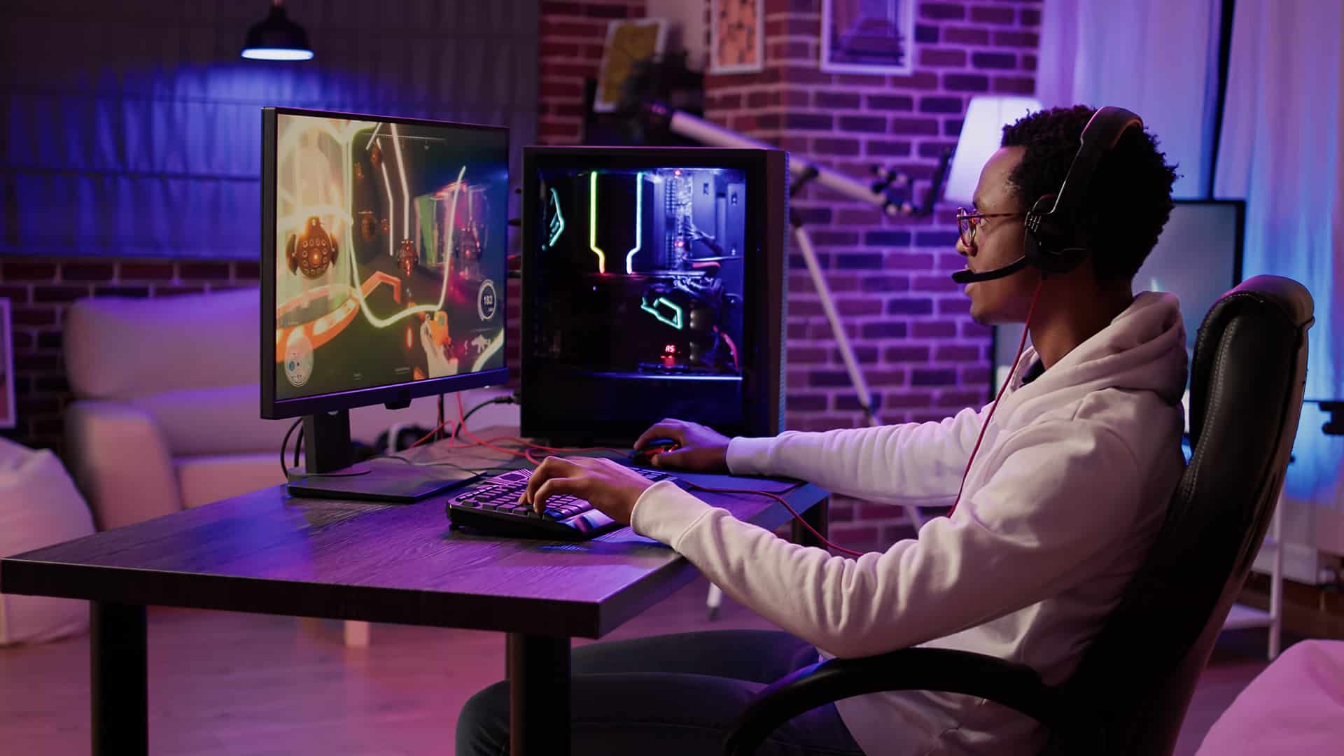 Gamer playing online using a high-end computer setup