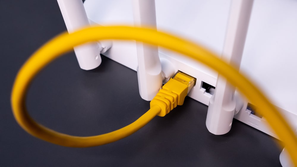 Yellow router plugged into modem