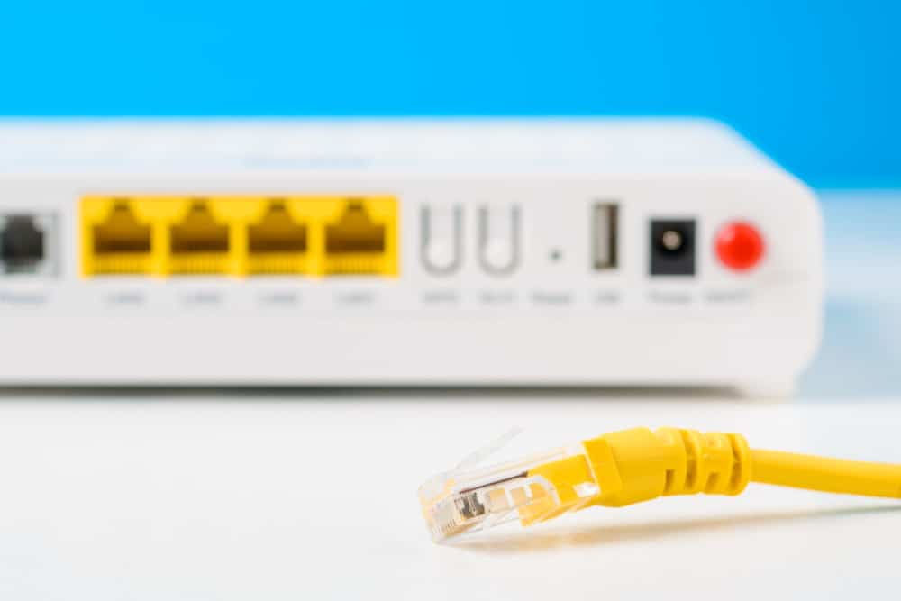 Yellow Ethernet cable unplugged from the modem