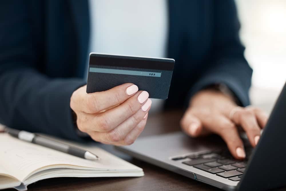 Woman using a credit card for online shopping