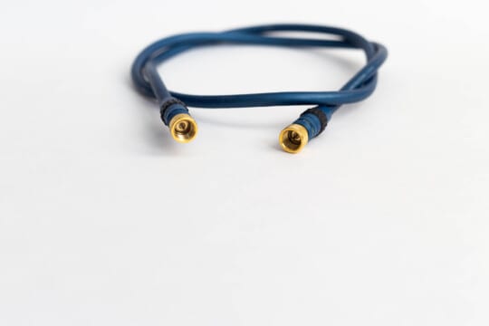 Coiled-up navy blue coaxial cable