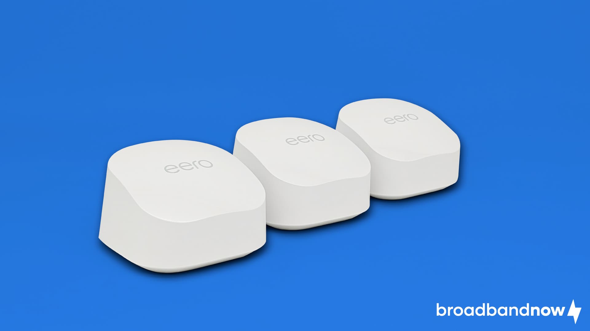 Three eero 6+ routers on a blue background