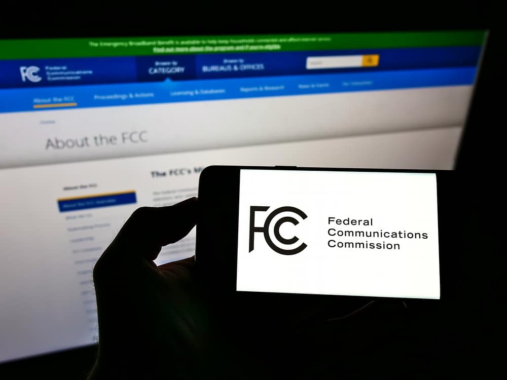 FCC website on smartphone and computer screens