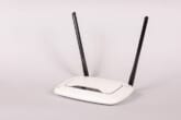 A Wi-Fi router isolated on a gray background