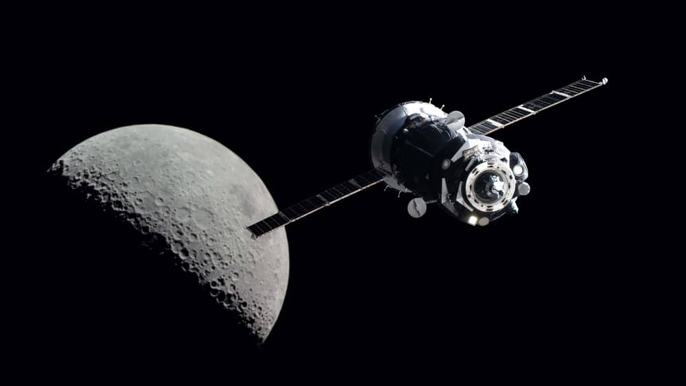 A satellite in space with the moon in the background