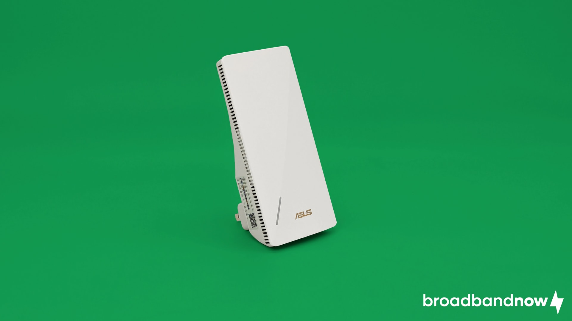 An Asus RP-AX58 Wi-Fi extender on a green background.