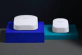 Two white eero devices resting on colored risers.