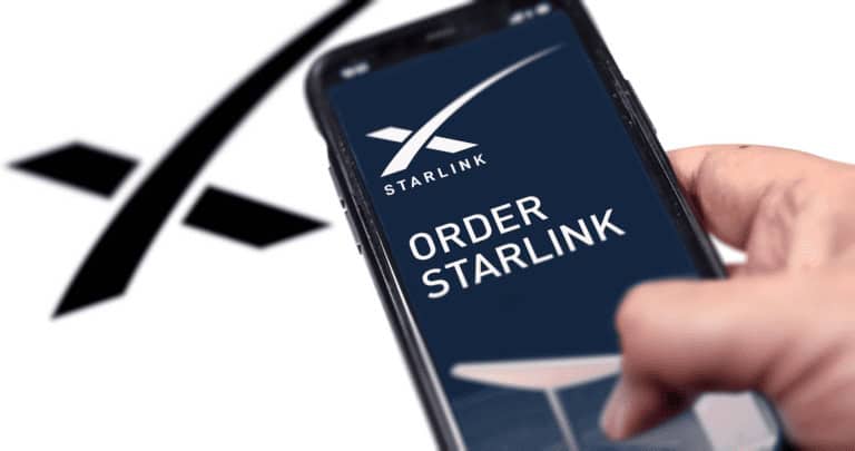 Person clicking a phone with the text “Order Starlink” on it