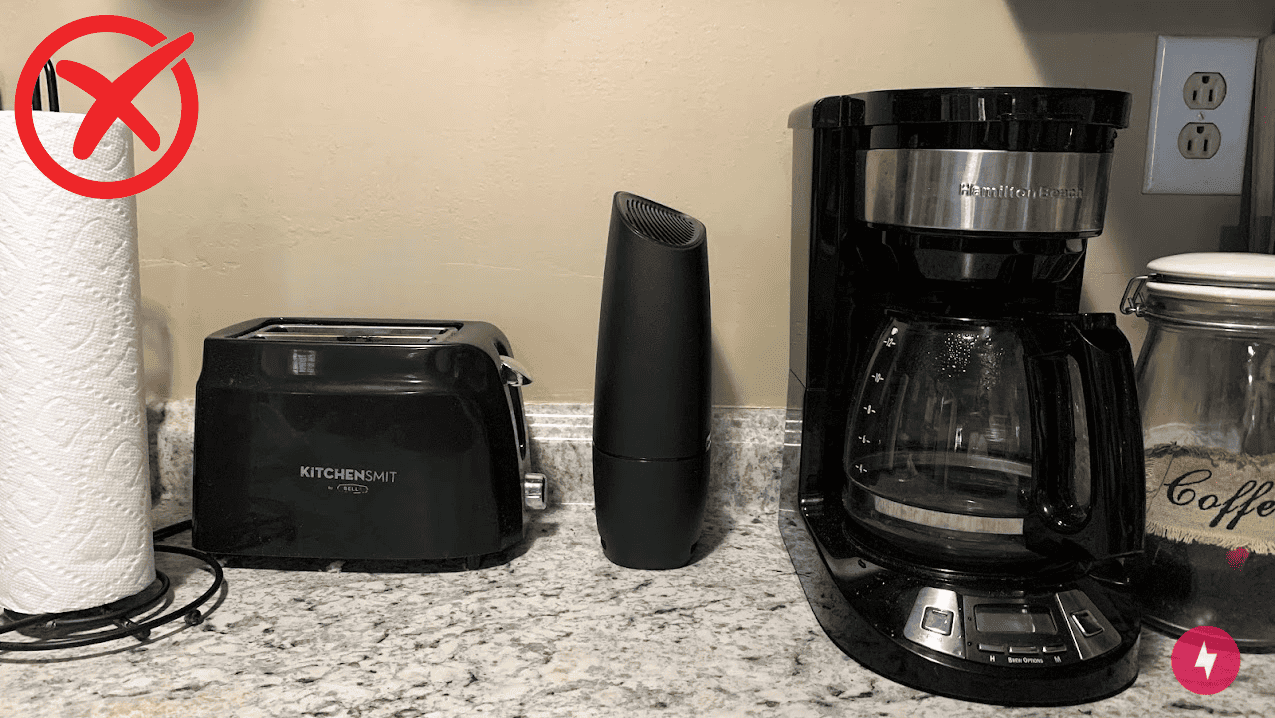 Kate Fann's Spectrum router on the kitchen counter positioned between a toaster and a coffee maker.