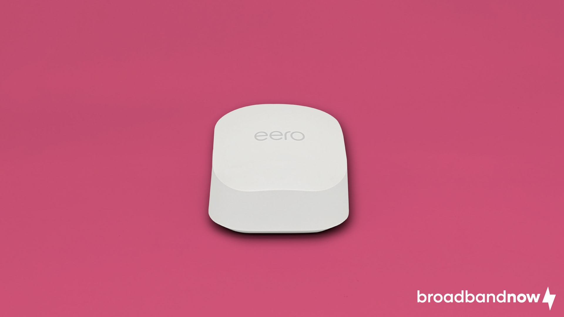  eero 6+ Wi-Fi router on a pink background