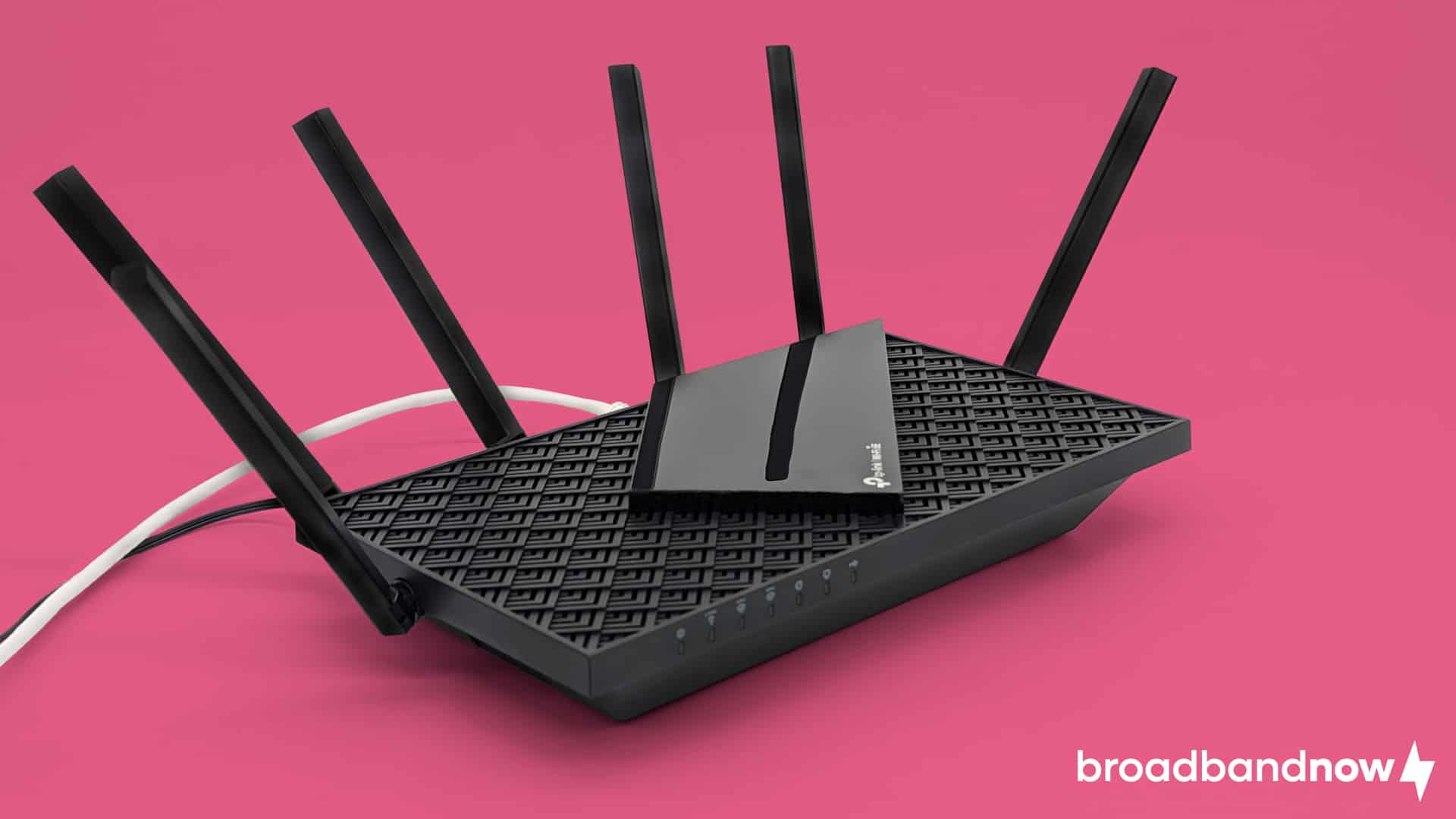Photo of the TP-Link AXE75 Wi-Fi 6E router with cords plugged in