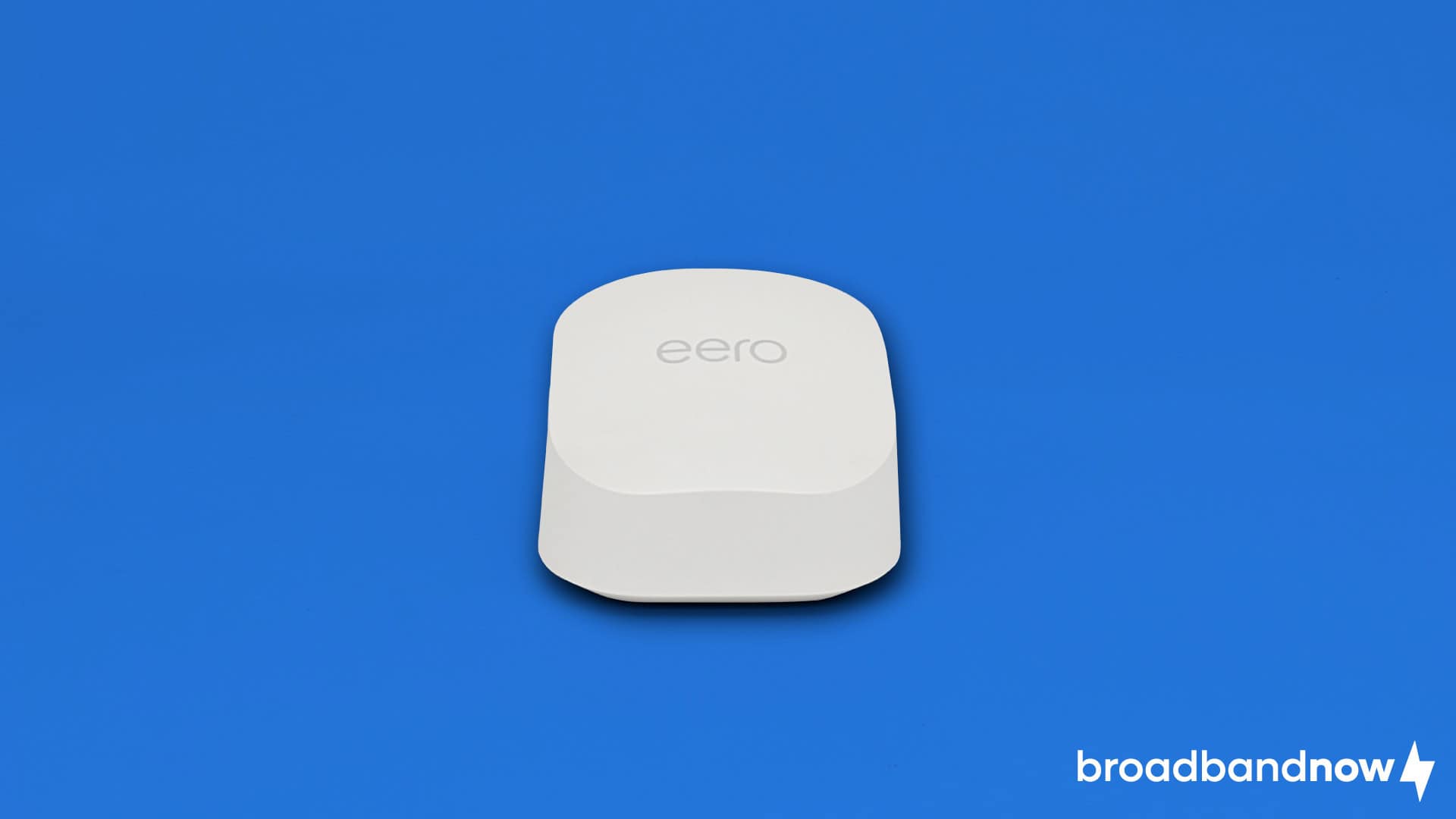Photo of an Amazon eero 6+ Wi-Fi router on a blue background