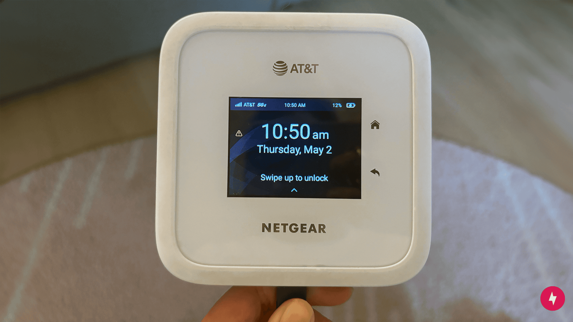 Closeup photo of AT&T Netgear Nighthawk M6 with the date and time shown on the screen.