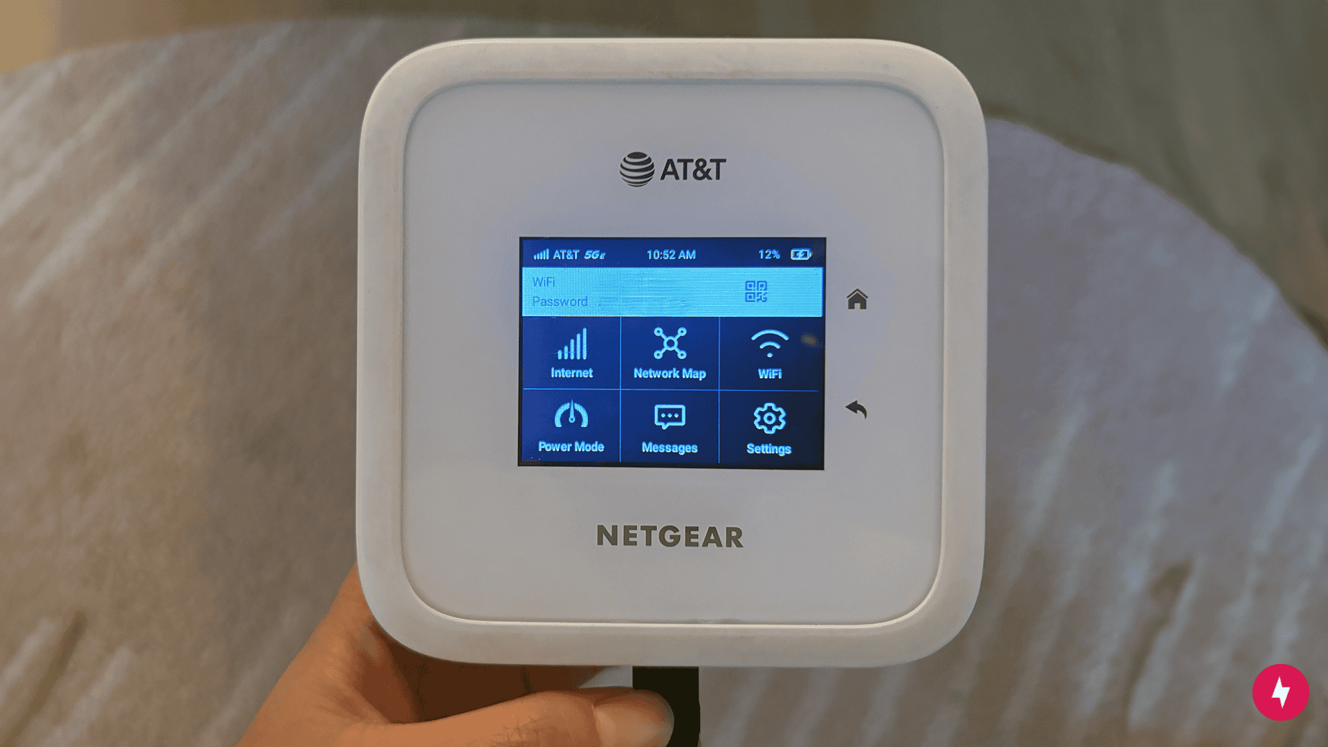  A closeup photo of AT&T Netgear Nighthawk M6 with the settings on the screen.