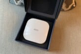 An Eero Pro 6 device resting in its box.