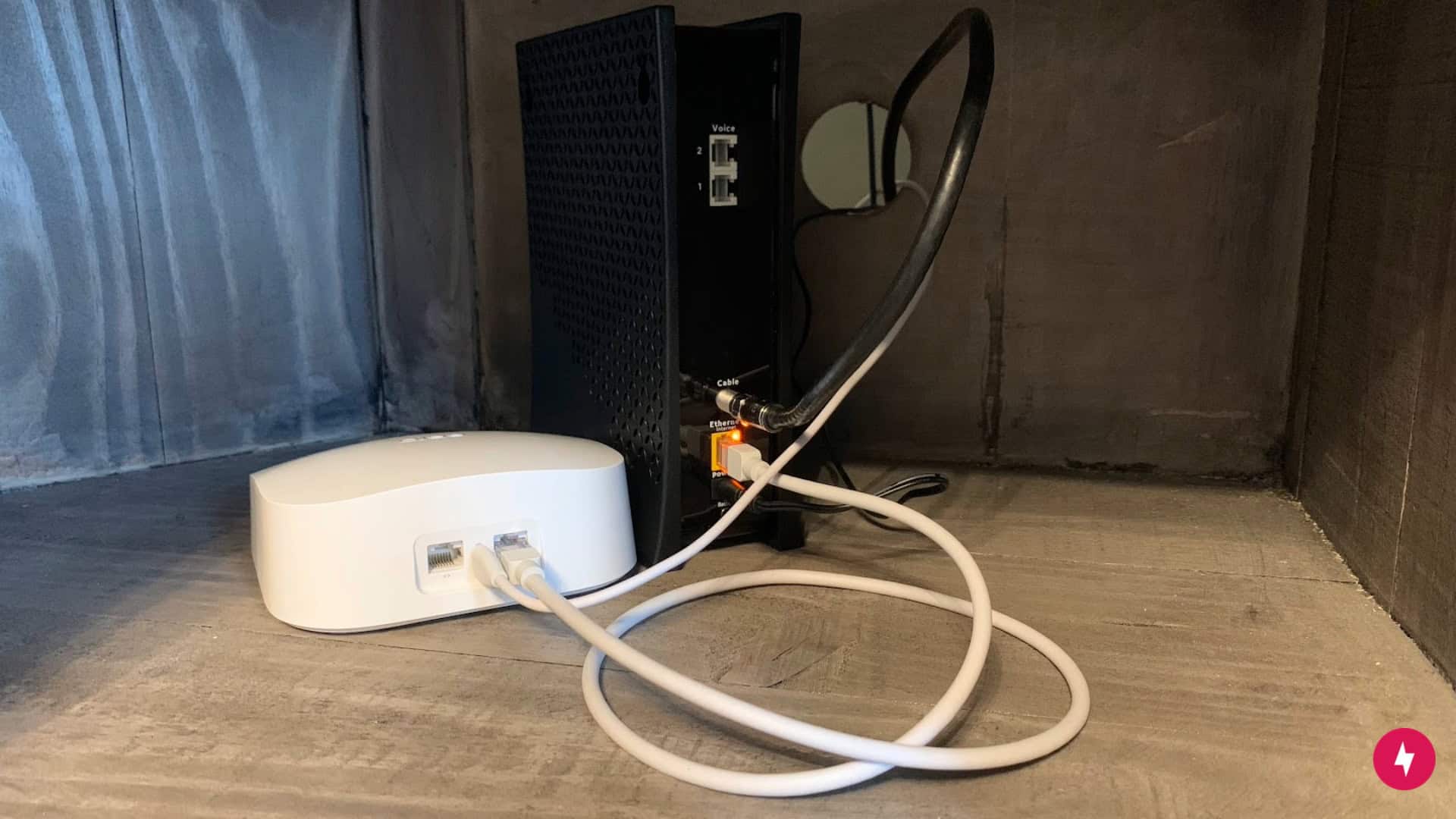  A Spectrum modem and Eero router connect via an Ethernet cord.