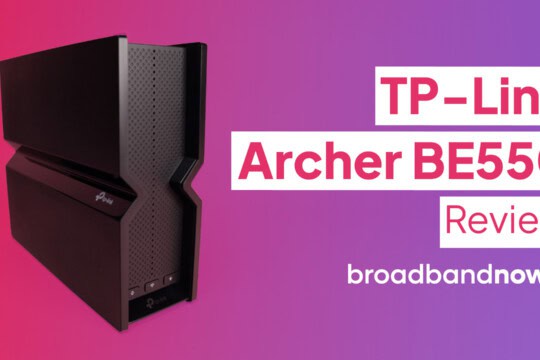 The TP-Link Archer BE550 against a pink backdrop