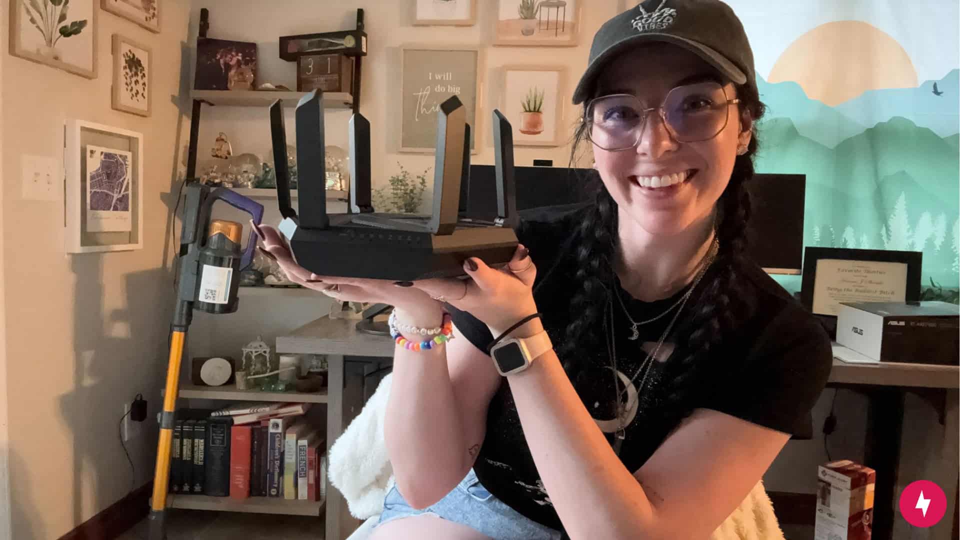 Hanna holding up the Asus-RT-AXE7800. 