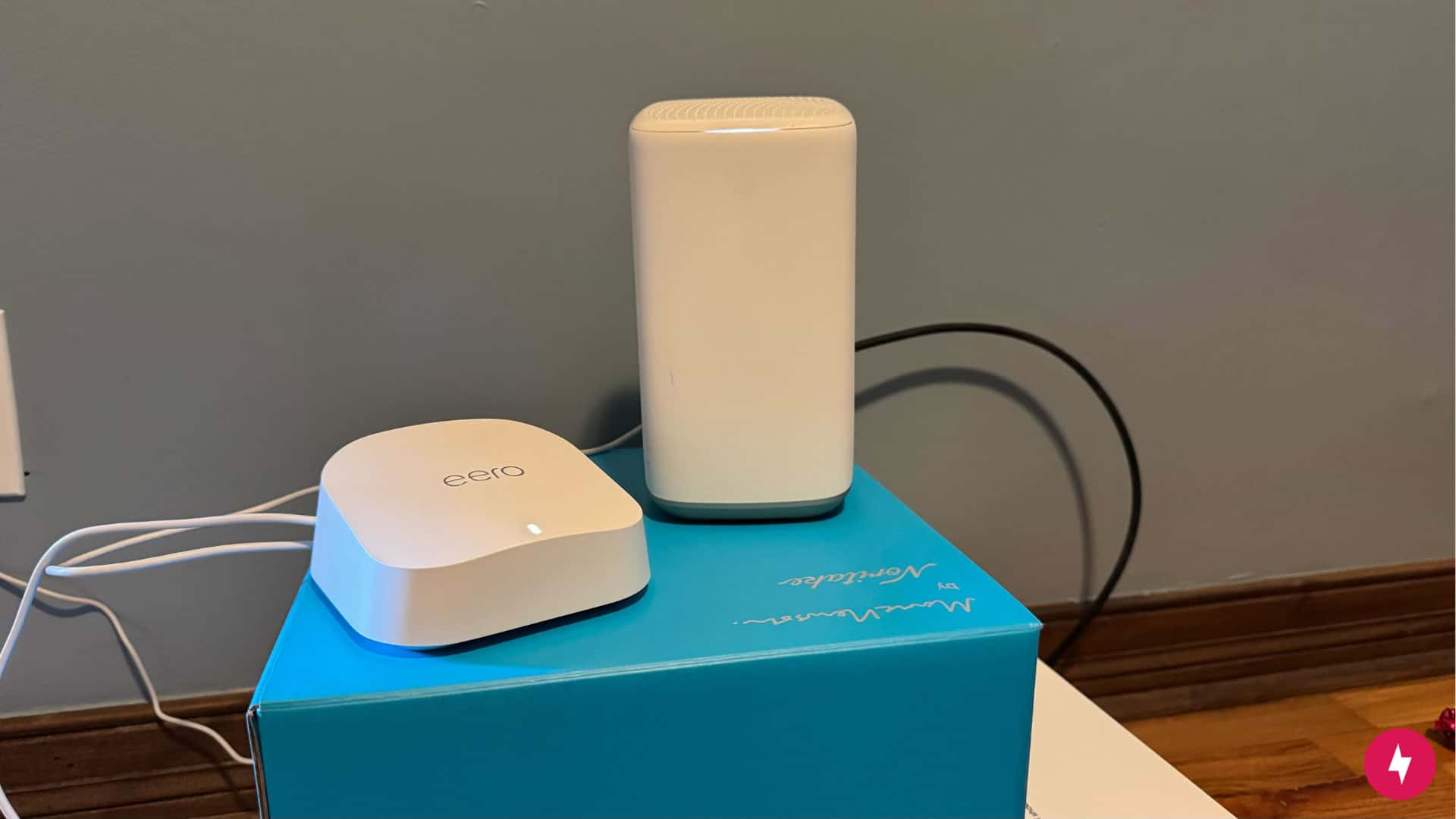 The main eero 7 node next to the Xfinity Gateway.