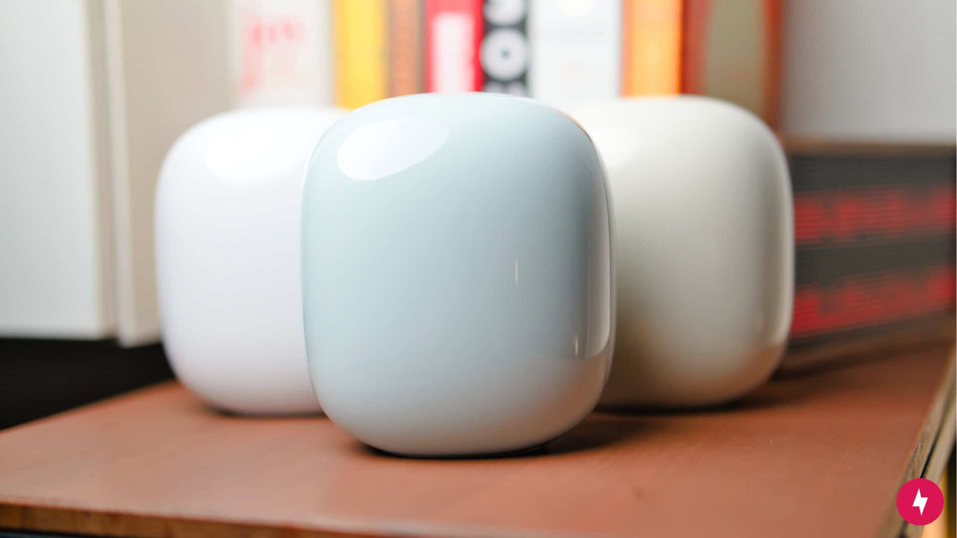 Three Google Nest Wifi Pro nodes on a table.