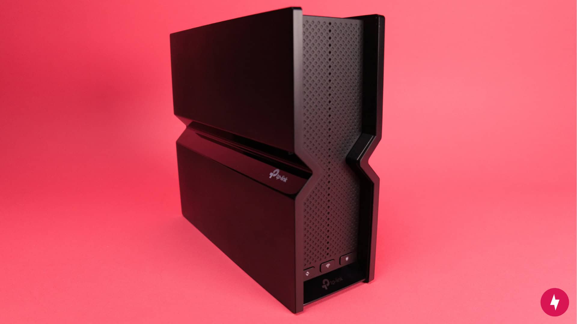 The TP-Link Archer BE550 against a red backdrop.